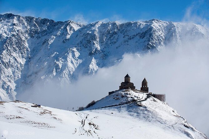 Discover the Majestic Georgian Highlands - Ananuri Fortress: stone towers above the water