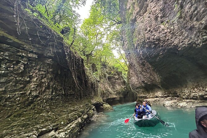 From Kutaisi: Canyons and Caves Tour with Transfer to Tbilisi - Walking the mossy walls of Martvili Canyon