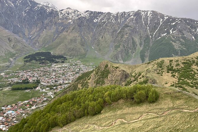 Kazbegi.All inclusive tour in Caucasus mountains - The Friendship Arch and the Road to Stepantsminda