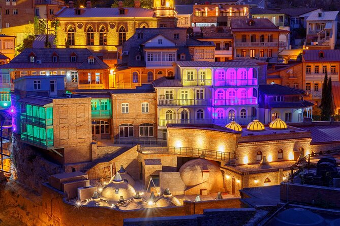 Tbilisi:Evening Walking & Talking Tour with Wine & Boat Ride - Crossing the Bridge of Peace after dark